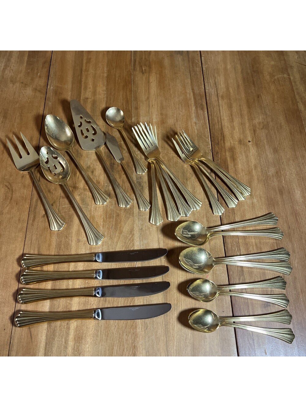 International Stainless Golden Flair Place Setting For 4 + Serving Pieces